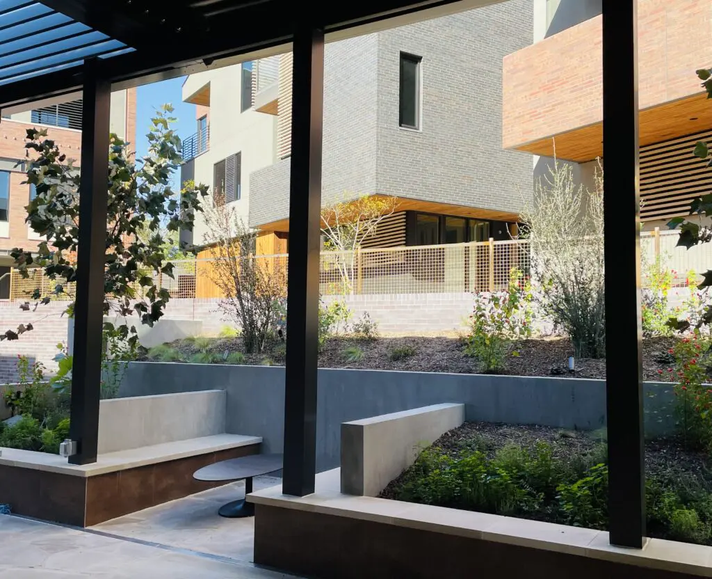 Shady courtyard with built-in banquette seating. (Photo by Courtney Dabney)