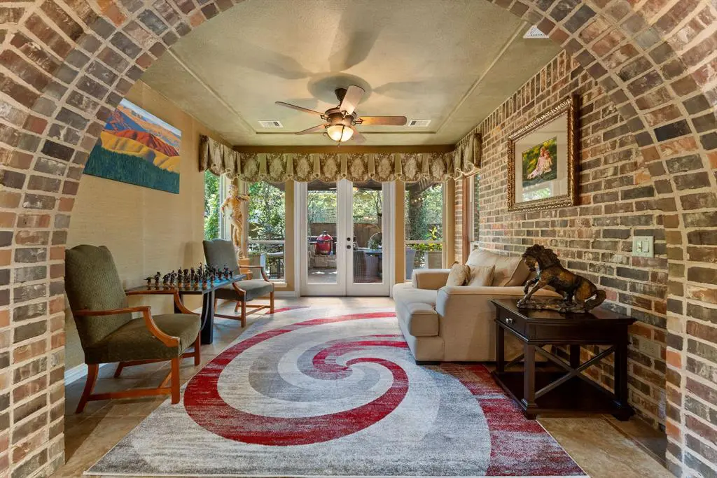 One of the many spaces to enjoy is the sun room, perfect for quiet moments or a game of chess.