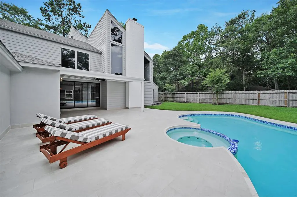 4 Greenridge Drive has a contemporary pool and a backyard space with plenty of room for personalization. 