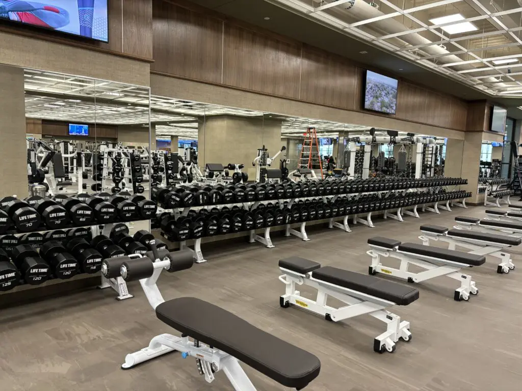 Life Time has dumb bells up to 135 lbs, and plenty of bench space.