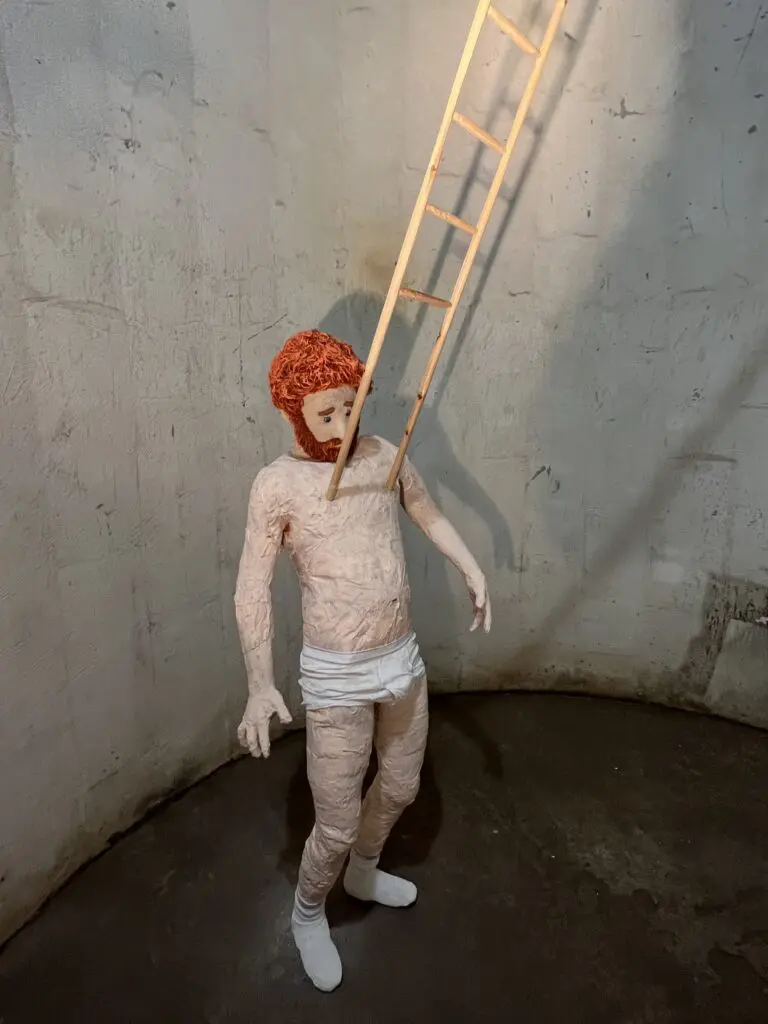 Dallas provocateur Jeff Gibbons' "Ladder Nipples (Nipocchio)" serves up a wry self-portrait at The Silos at Sawyer Yards where it dialogues with the Site Gallery's industrial relic the former Success Rice silos. (Photo CDA)
