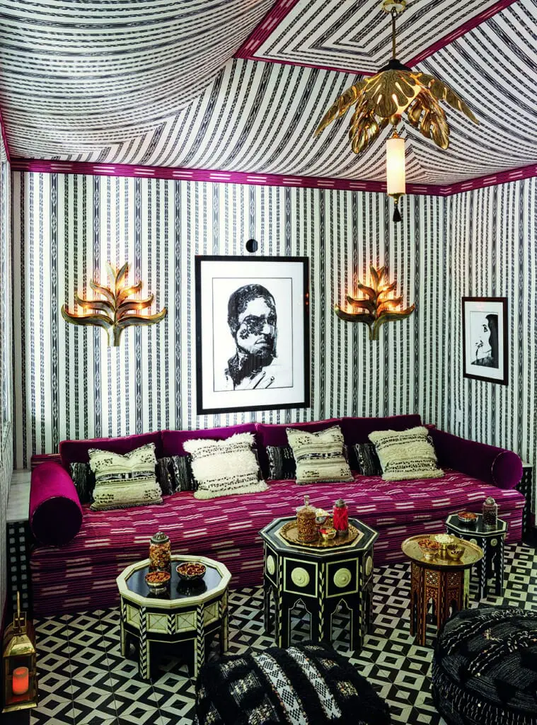 In Martyn Lawrence Bullard's home, a screening room with Moorish tables from his own line and vintage Italian plum leaf wall sconces from Guinevere Antiques London. (Photo by Douglas Friedman)