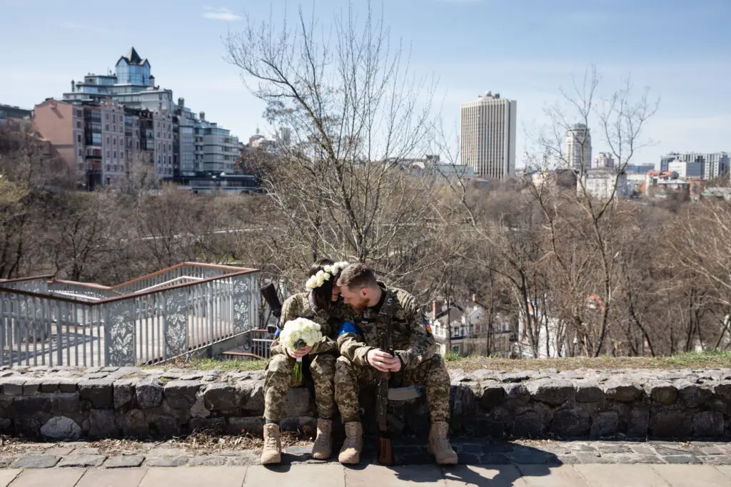 Wedding of Anastasiia Mokhina, 24, and Viacheslav Hohlyuk, 43, two members of the Kyiv Territorial Defense who married under martial law in Kyiv, Ukraine. April 7, 2022. (Photo by Mikhaylo Palinchak. Courtesy of Ukrainian Association of Professional Photographers.) 