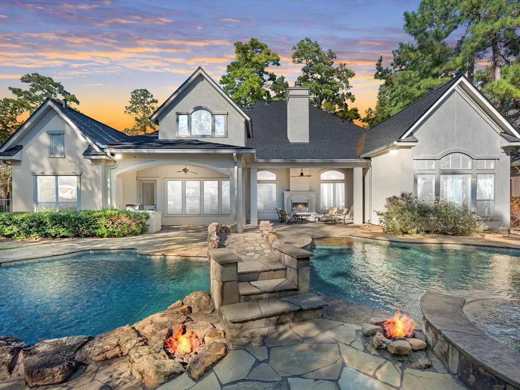 The pool at 11 Pine Lodge Place is a stunning feature of this Woodlands mansion.