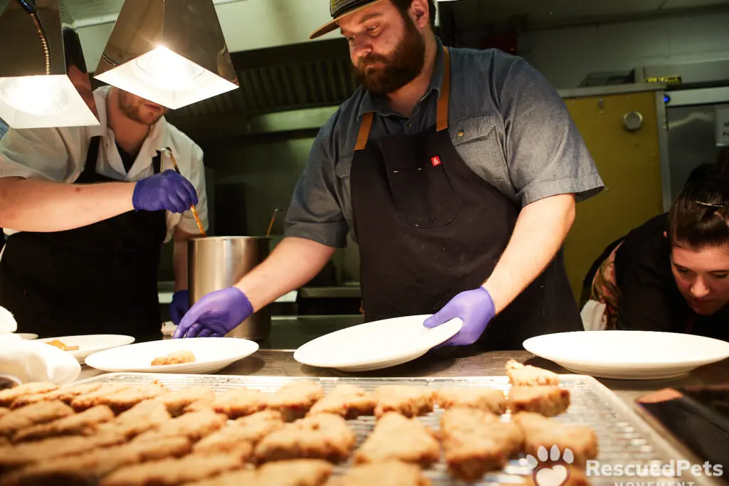 Chef Graham Laborde of Winnie’s preparing plates at last year's Chefs for Paws. (Photo by Rescued Pets Movement)
