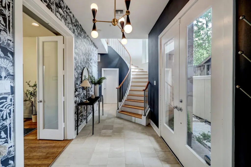 4419 Mandell Street's luxurious floors are connected by a reclaimed, hardwood spiral staircase.