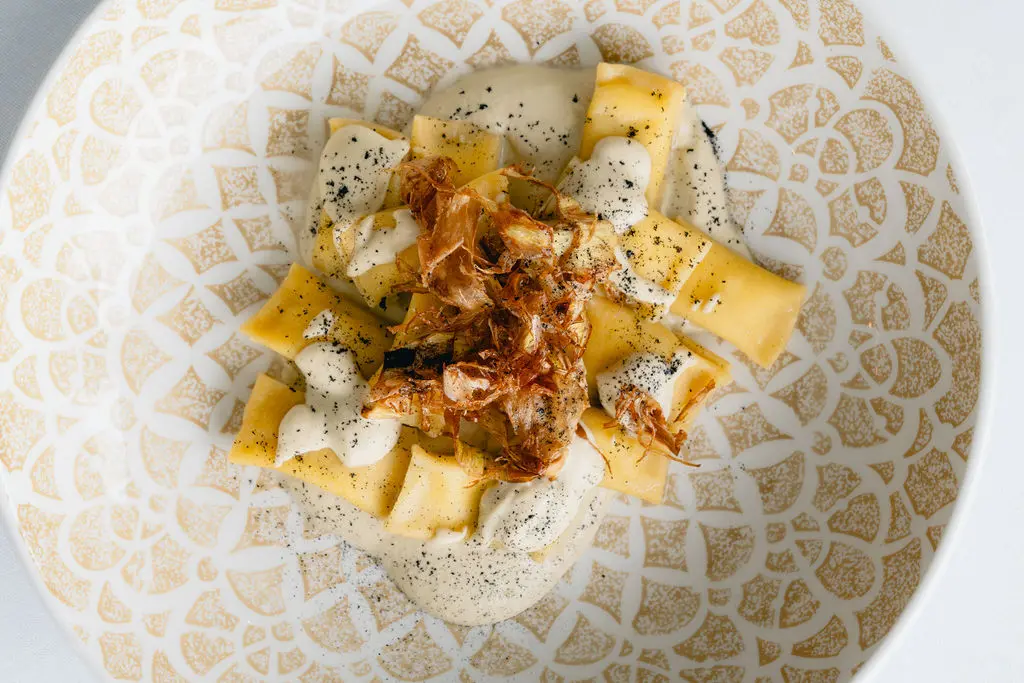 Don’t miss Tavola's clever (and delectable) take on the Roman classic, cacio e pepe ($32) which takes the form of handmade, pillowy soft agnolotti. Each diminutive bite is filled with the creamy, peppery Romano cheese sauce and sits atop a puree of smoked artichoke, sprinkled with ribbons of those fried artichoke leaves.