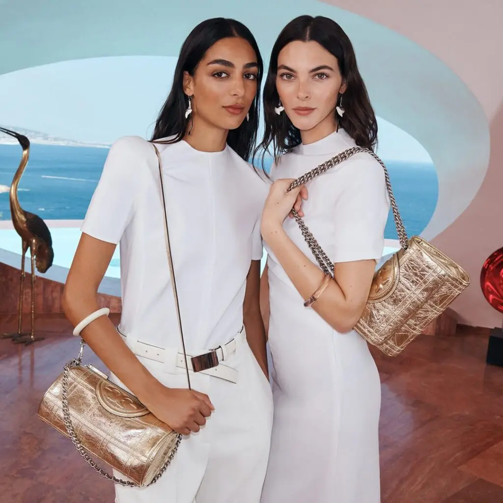Tory Burch's barrel shaped golden pin-stitched quilted design is a metallic bag to swoon over.