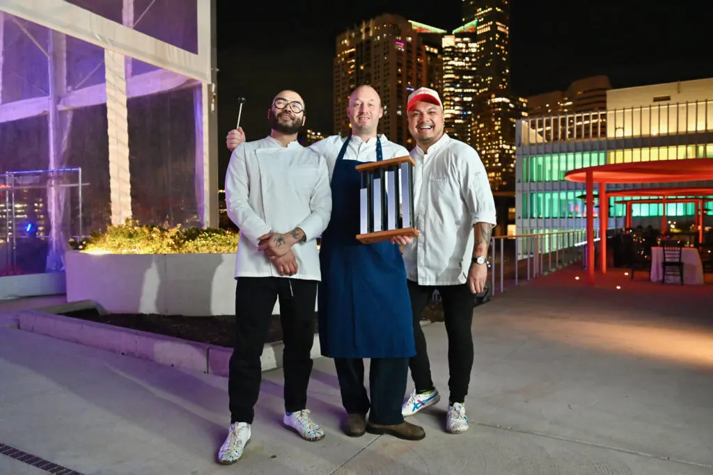Chefs Paul Qui, Chris Haatuft, Tom Cunanan cooking at the Baylor College of Medicine 'Culinary Stars Shine for Cancer Research' dinner at POST Houston (Photo by Alejandro Montoya)