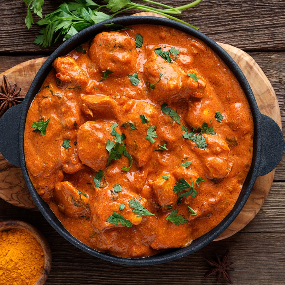 Spice Zest's menu includes chicken curry ($14) made with house chicken curry, cumin-scented basmati rice and topped with papadum (cracker) crumble. (Photo by Sunil Srivastava )