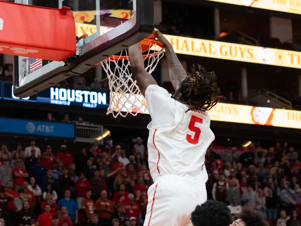 University of Houston center Ja'Vier Francis benefits from Jamal Shead's dunk-creating passes. (Photo by F. Carter Smith)