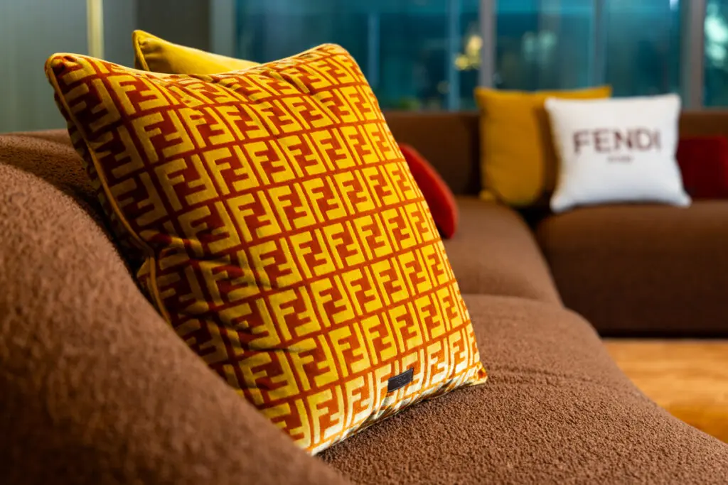 Fendi casa Double F logo cushion in the lobby of Residences at The Allen. Decor by BeDesign.  (Photo by Shannon O’Hara Photography)