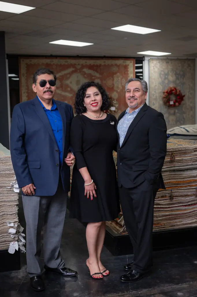 Josue Jimenez-Rios, Marisol Jimenez-Aranda, Edward Aranda at the Turkish Rug Company showroom grand opening party benefiting the Salvation Army.