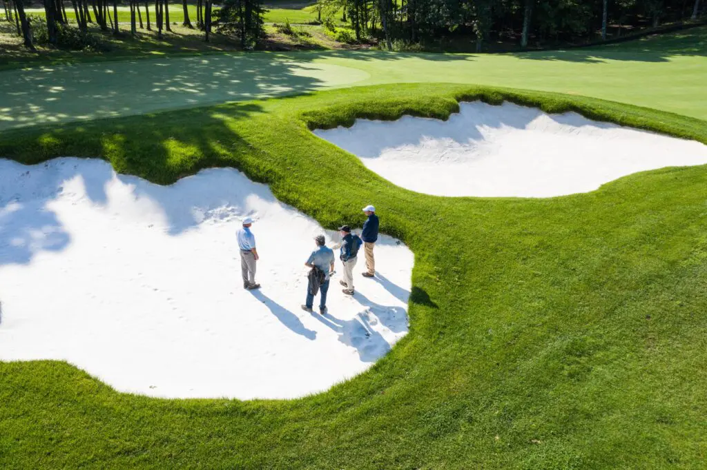 Kelly Ranch - Golf Course architect Tripp Davis explores a designed bunker at another project, The International.