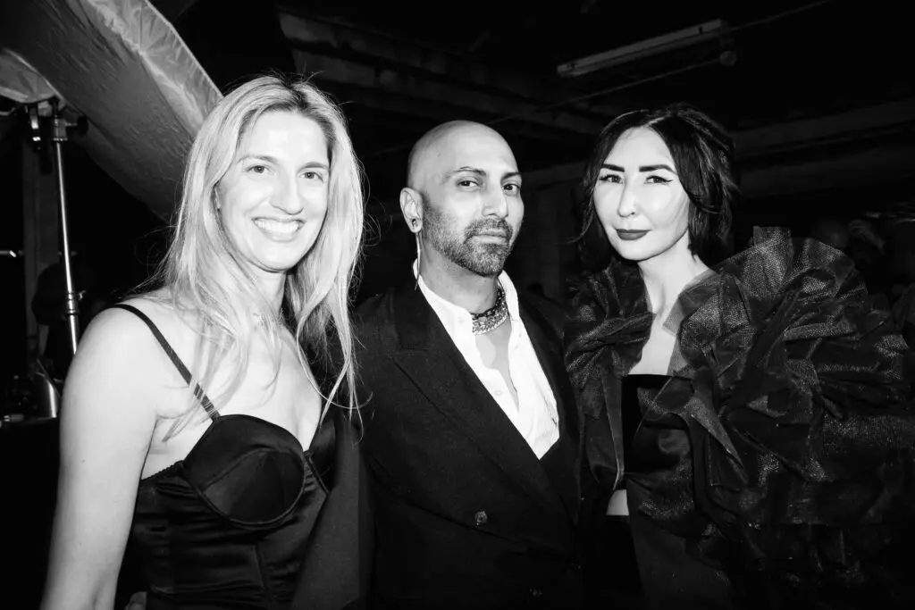 Co-chairs Chris Goins and Carrie Brandsberg-Dahl with designer René Garza at Magpies & Peacocks After Dark (Photo by Jesse Greene)