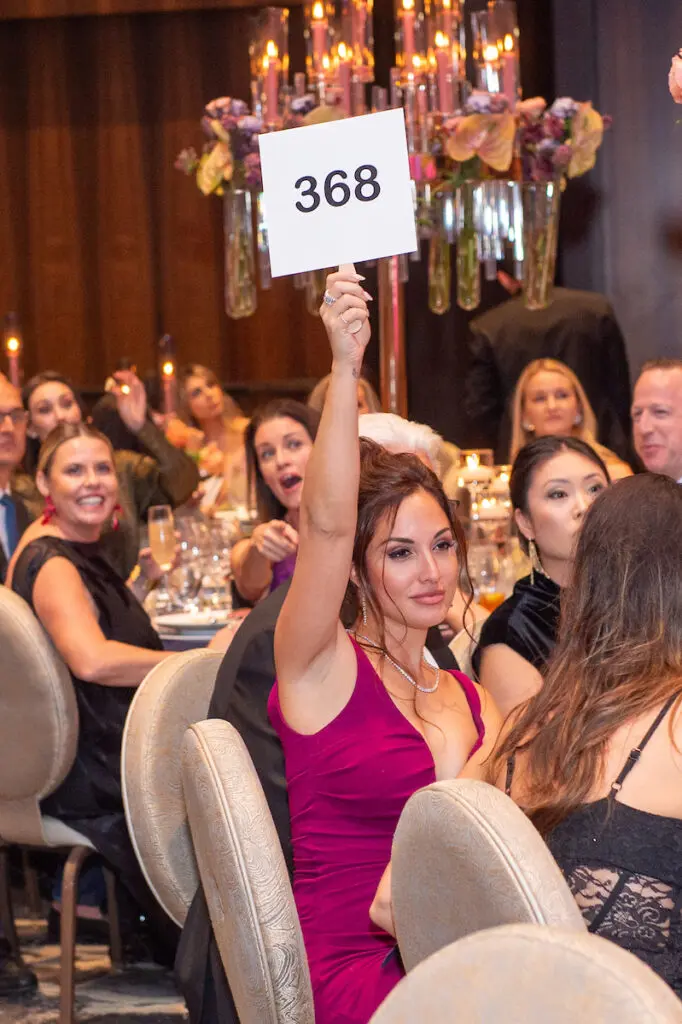 Sara Perry bids on artwork at the Arts of Healing Foundation Physician Art Show and Dinner at the Post Oak Hotel (Photo by Jacob Power)