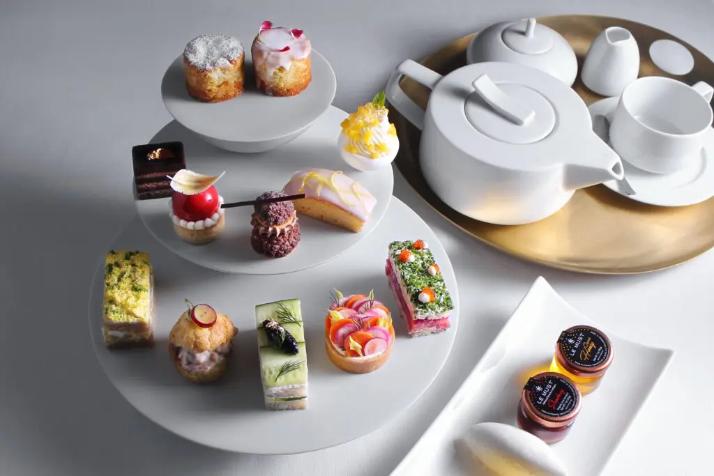 Enjoy a traditional tea service featuring Ikaati hot teas paired with sweet and savory bites.