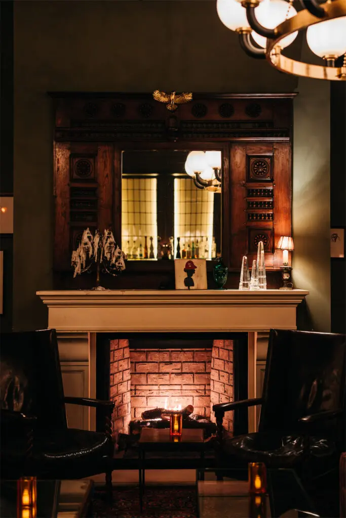 A grand fireplace inspired by Gramercy Park Hotel’s iconic Rose Bar is a highlight of The Rô on Oak space. (Courtesy)