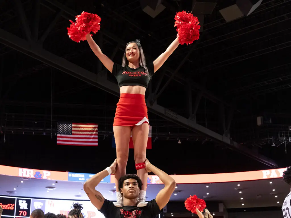 The cheerleaders add to the atmosphere at Fertitta Center. (Photo by F. Carter Smith)