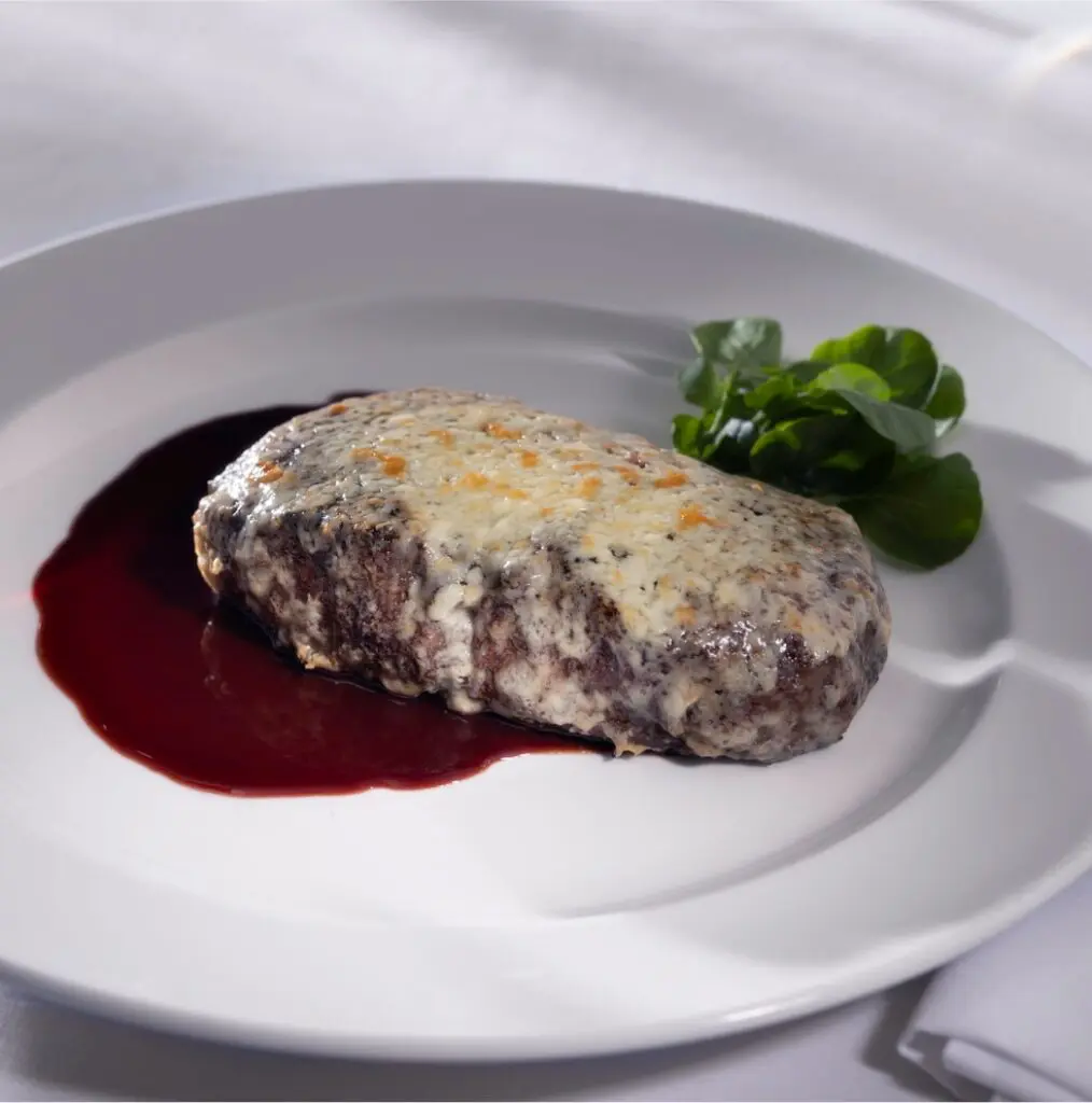 Capital Grille serves a spectacular gorgonzola-crusted dry aged New York strip, enhanced by a tart cherry cabernet reduction.