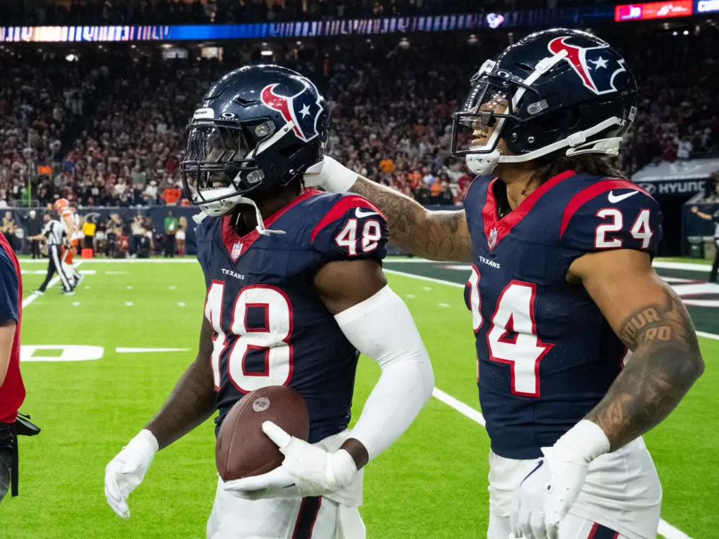 Houston Texans defenders Christian Harris and Derek Stingley Jr. know it's best to celebrate together. (Photo by F. Carter Smith)