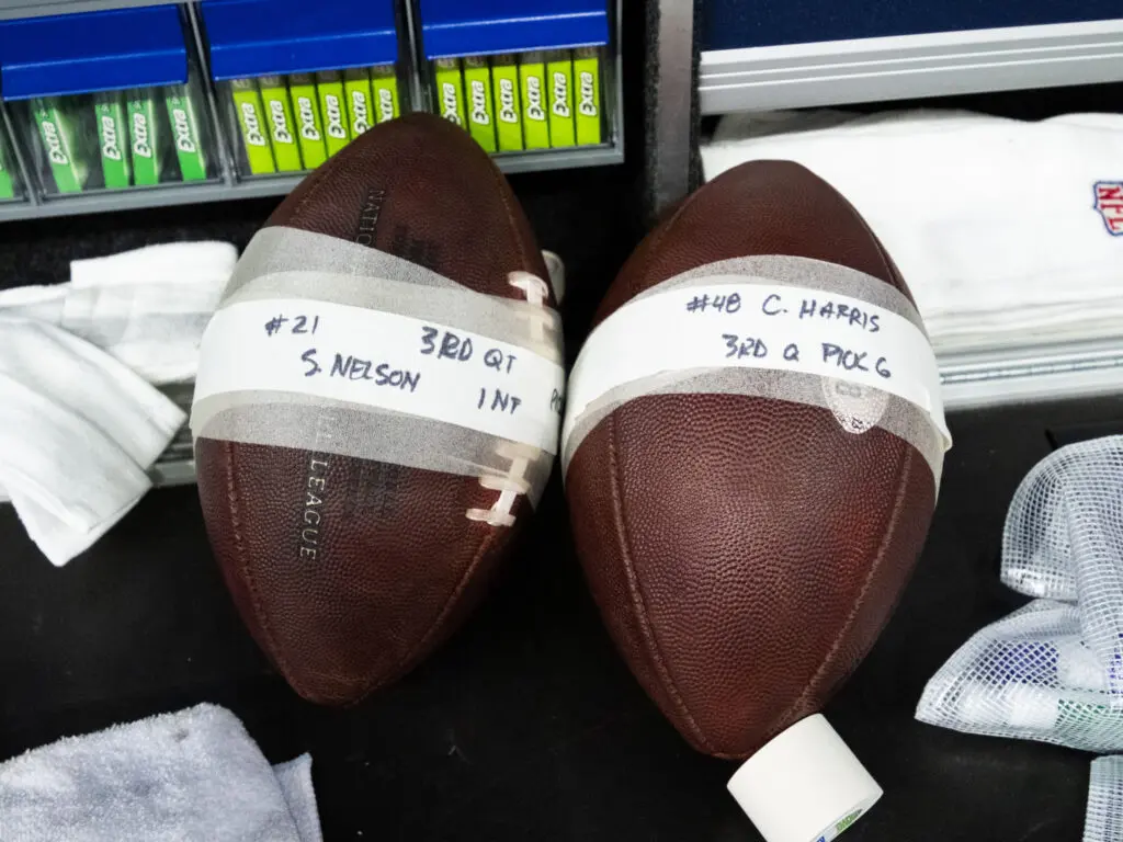 The back to back Pick 6 footballs for Texans are put aside for souvenir safe keeping. (Photo by F. Carter Smith)