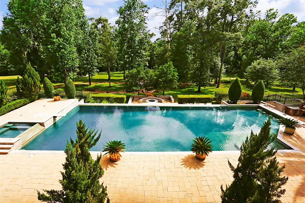 Perfect landscaping and a contemporary pool are among the features at S 126 Tranquil Path. 