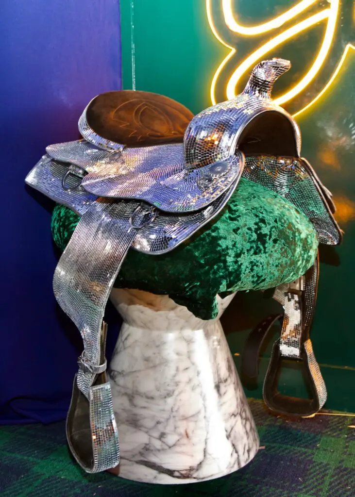 A custom Beyoncé-inspired saddle at the entrance of the Gold Pony Lounge at the Cotton 'Q' Club. (Photo by Ashley Patranella, Painted Peacock Photography)
