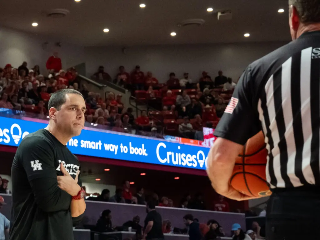 UH assistant coach Kellen Sampson took over for his dad on the sidelines and gave the refs some messages of his own. (Photo by F. Carter Smith)