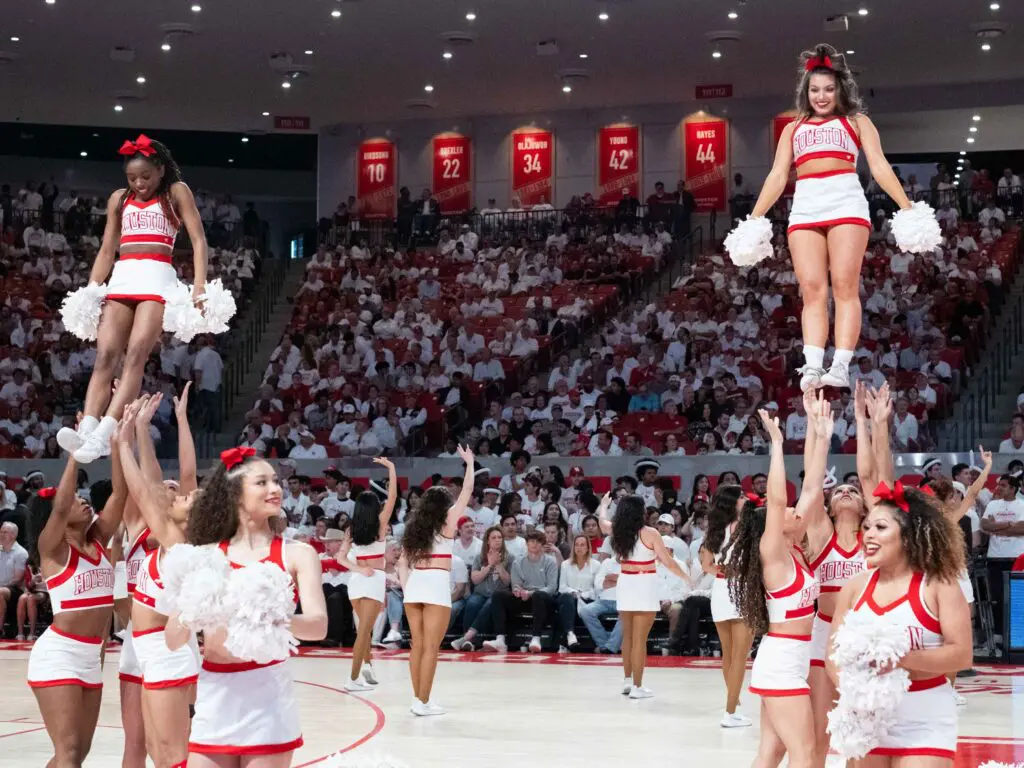 The UH cheerleaders bring plenty of spirit to the Fertitta Center scene. (Photo by F. Carter Smith)