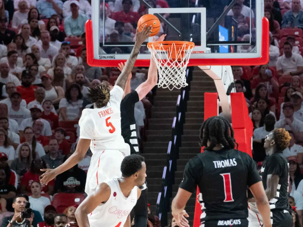 Ja'Vier Francis attacks the rim for Houston's juggernaut program. (Photo by F. Carter Smith)