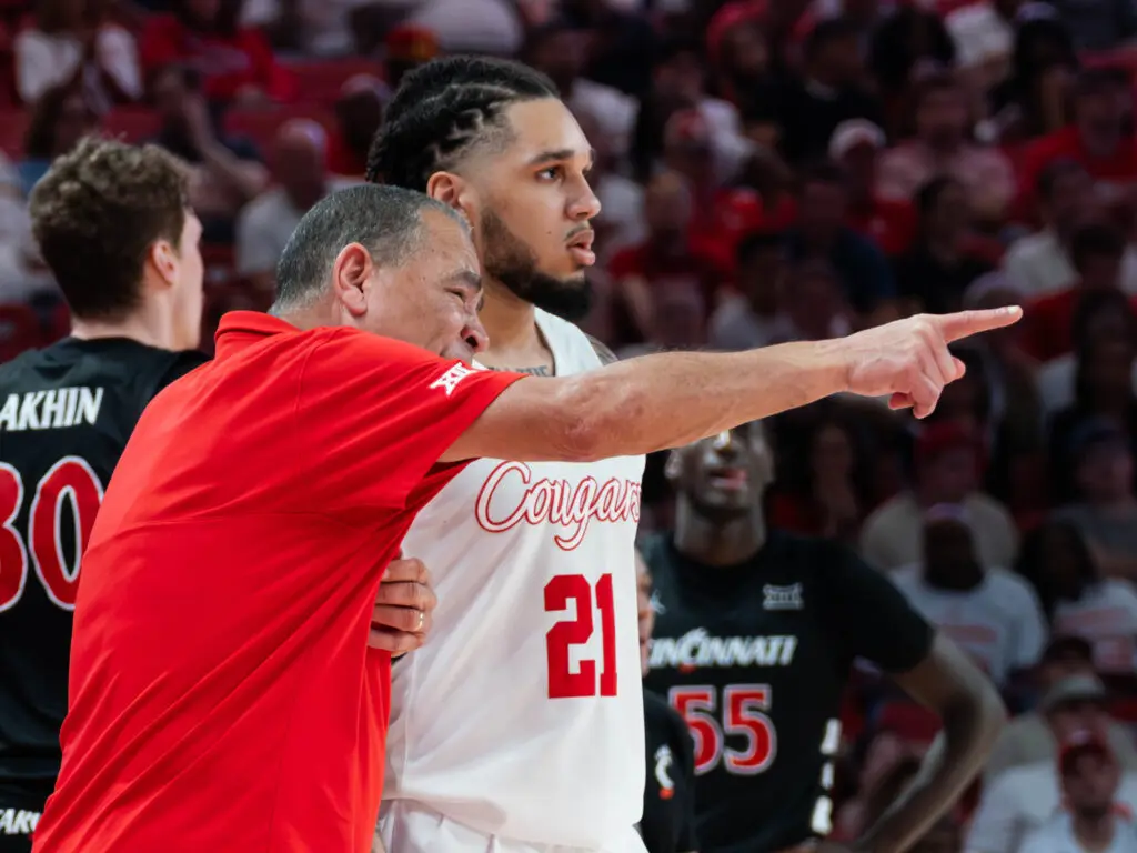 UH coach Kelvin Sampson is always pointing out something to players like Emanuel Sharp. (Photo by F. Carter Smith)