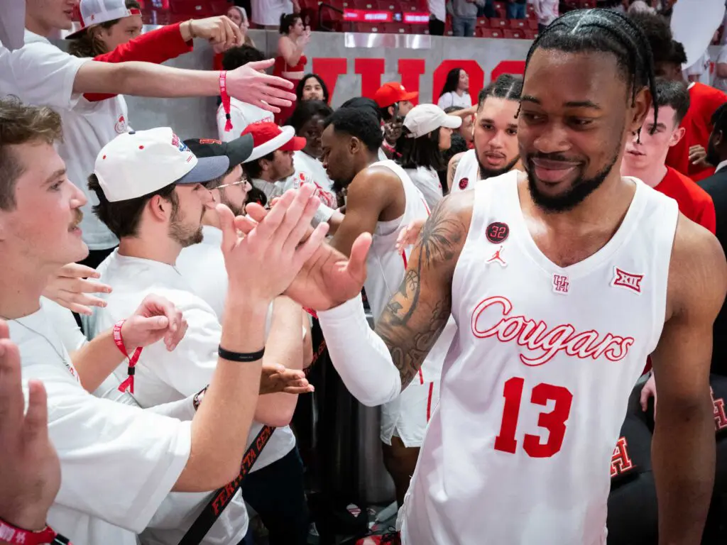 UH power forward J'Wan Roberts gives some love to the Houston student section after another Fertitta Center win. (Photo by F. Carter Smith)