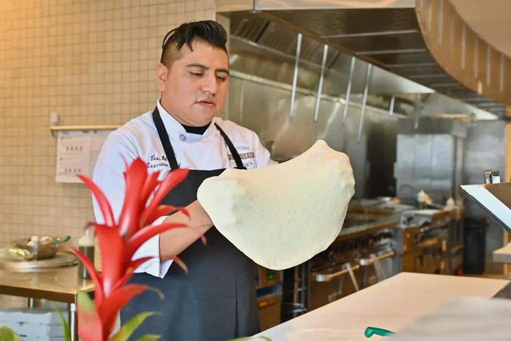 Magdalena's executive chef Luis Silva prepares Neapolitan-style pizza at this new West University Italian spot. (Photo by Alex Montoya)