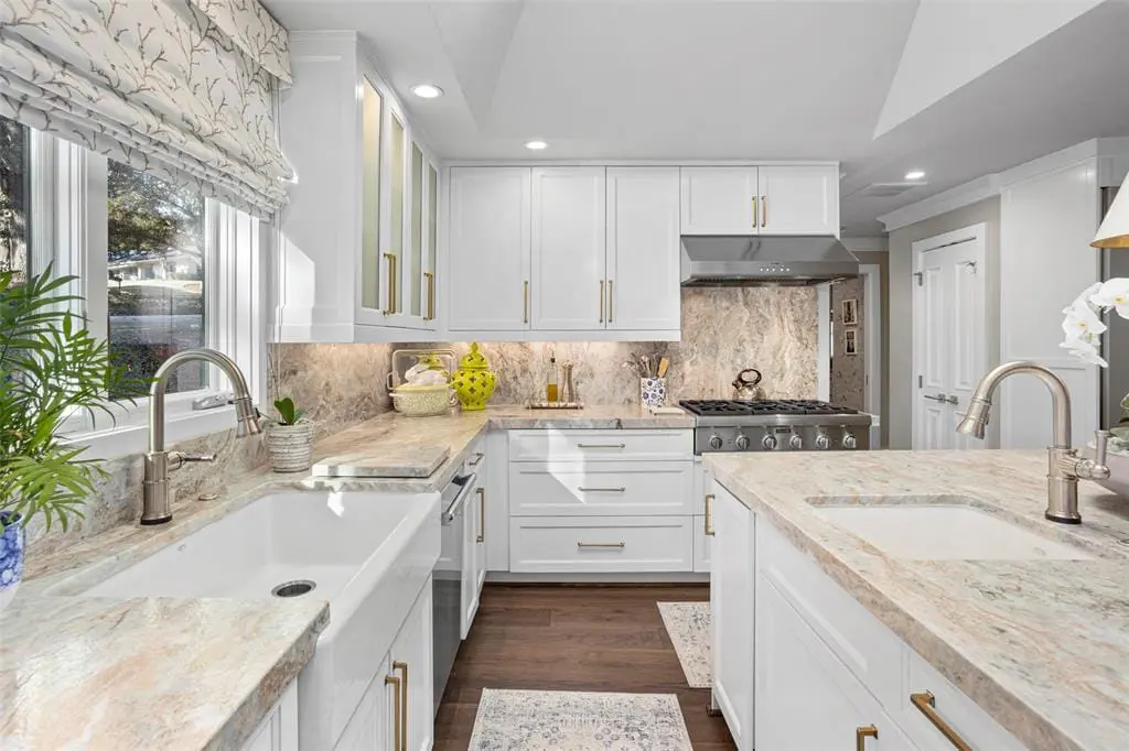 At 1401 Westover Lane, marble flows from countertops up the walls in this chef's kitchen. (Courtesy photo)