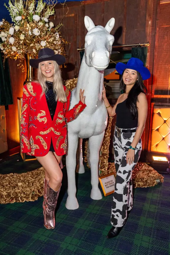 RodeoHouston cowgirls pose for Instagram moments with in the Cotton 'Q Club party tent. (Photo courtesy of Cotton Holdings Inc.)