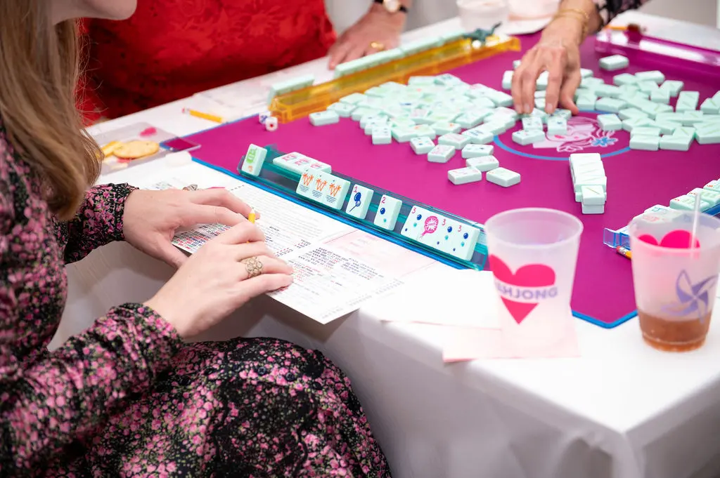 Dressed to the nines in red and pink, guests flock to the sold-out Valentine's Day-themed Mahjong for a Mission every year for a competitive afternoon of the ancient tile game. (Photo by Tamytha Cameron)