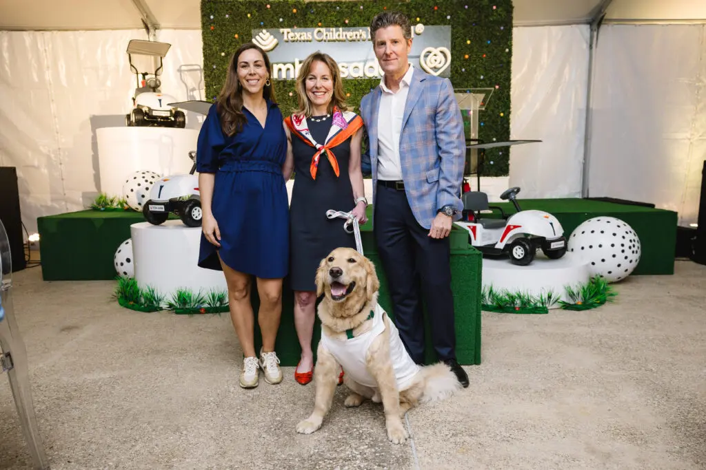 Julia TenHoeve, Debbie Sukin, Brian White with Pawsitive Play “caddie,” Cohen at Texas Children's Hospital 'Glow in the Park' event (Photo courtesy of Texas Children's Hospital