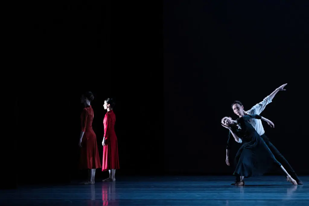 Houston Ballet principal Yuriko Kajiya and soloist Ryo Kato with artists of Houston Ballet in Jiří Kylián's "Overgrown Path." (Photo by Amitava Sarkar. Courtesy Houston Ballet)