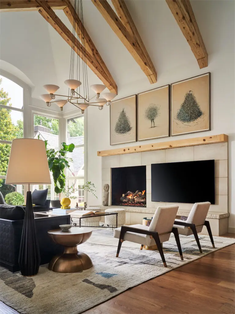 Bernard Quesniaux artwork in the living room is a Paris flea market find. Thomas Pheasant for Baker lounge chairs. Kelly Wearstler floor lamp. Custom cast-bronze table by Philip Thomas Vanderford. (Photo by Stephen Karlisch)