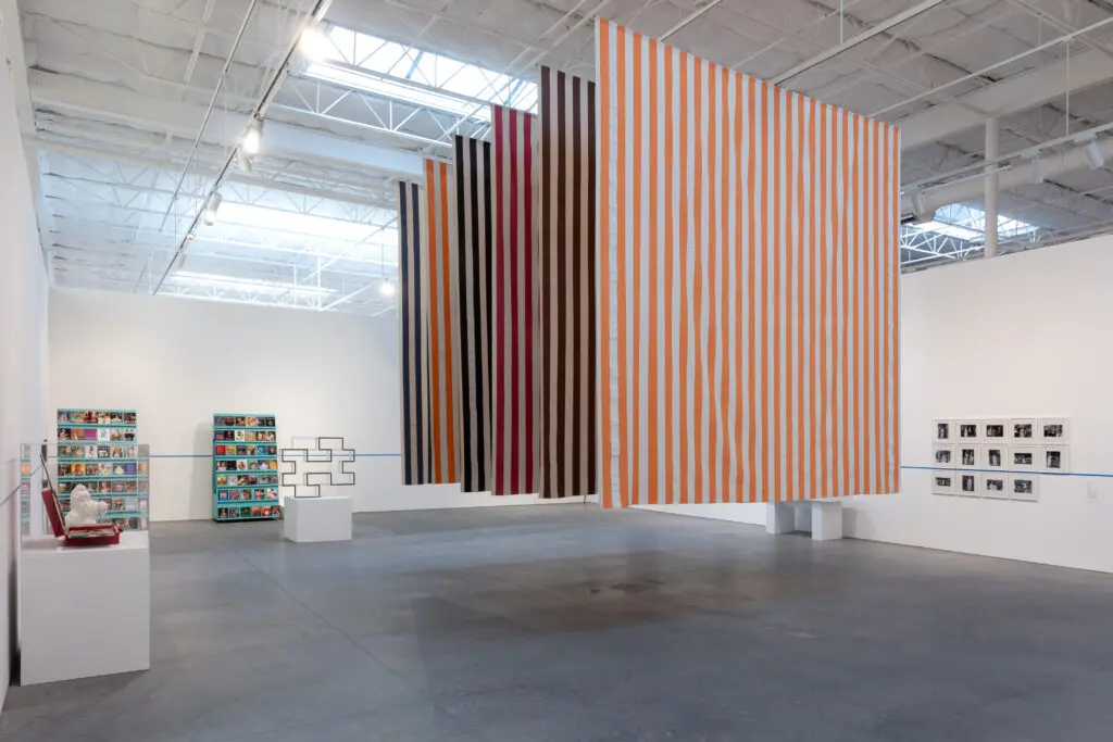 "For What It’s Worth: Value Systems in Art since 1960," The Warehouse,
Dallas, installation view with work by Ivan Moudov, Ditte Ejlerskov and EvaMarie Lindahl, Sherrill Roland, Daniel Buren, Lorraine O’Grady, and Edward Krasinski, on view through June 29, 2024 (Photo by Kevin Todora)