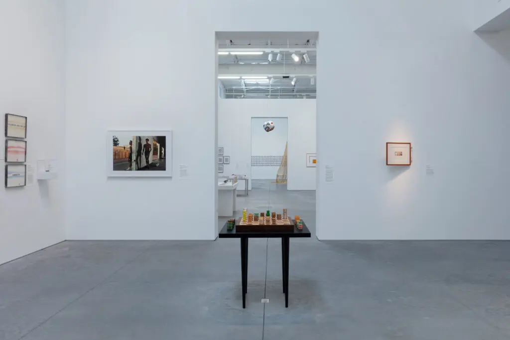 "For What It’s Worth: Value Systems in Art since 1960," The Warehouse, Dallas, installation view with work by Edward Kienholz (3 works), Antonio Vega Macotela, Philip-Lorca diCorcia, Agnieszka Kurant, and Chris Burden
(foreground); Lee Lozano (4 works), Michio Horikawa (6 works), Rirkrit Tiravanija, Eleanor Antin, John Latham (2 works), Steve McQueen, and Cildo Meireles (background), on view through June 29, 2024 (Photo by Kevin Todora)