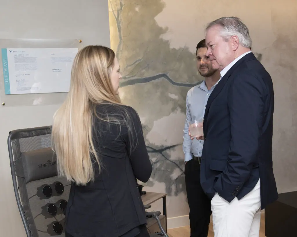 Owner John Goff talking to expert Brittany Malone about CR Vitality technology. (Photo by Tamytha Cameron)