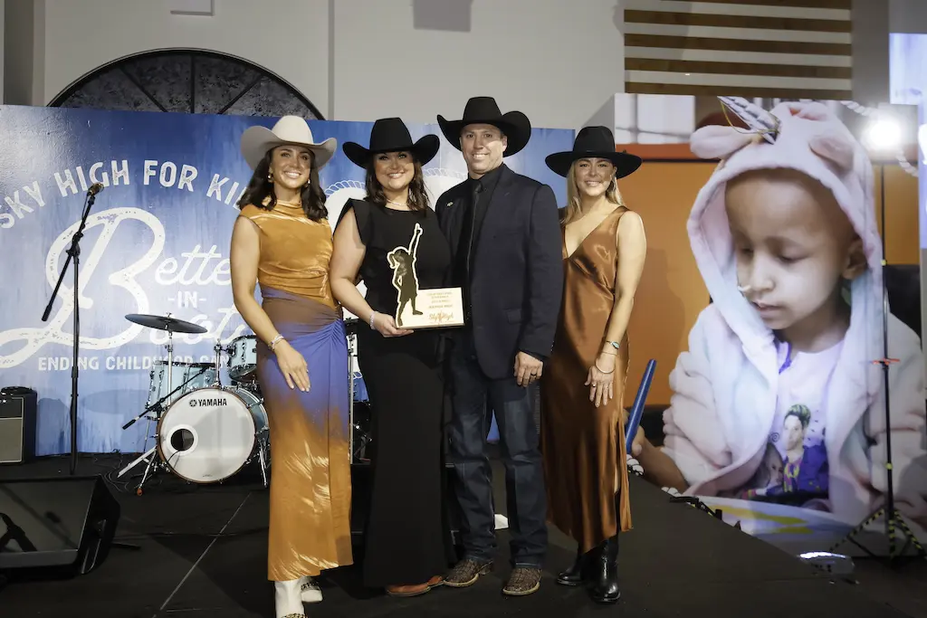 Chairs Erica Ferens and Lindsey Boatman, honored guests Natalie and JW Wright at the Sky High for Kids 'Better in Boots' gala at The Revaire (Photo by Quy Tran Photography)