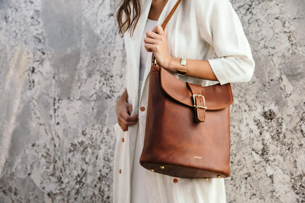 The Arlington shoulder bag with brass button bottom is a favorite from FOUNT.