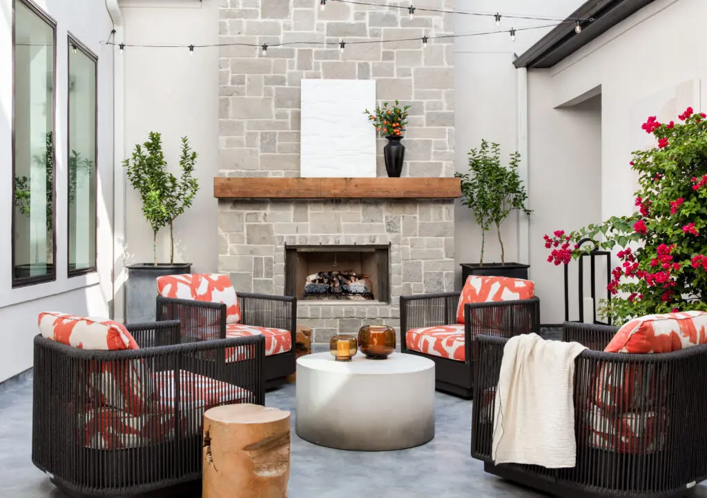 The courtyard is perfect for relaxing when the weather is good.  Lohman loves the pop of orange.