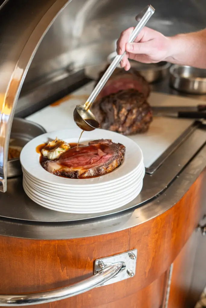 Each piece of USDA prime rib at The Landmark is served with a side salad, garlic mash, and au jus and horseradish cream. (Courtesy)