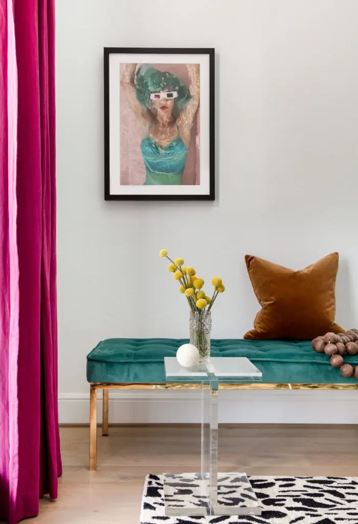The raspberry drapery is another colorful touch for Lohman's home office.