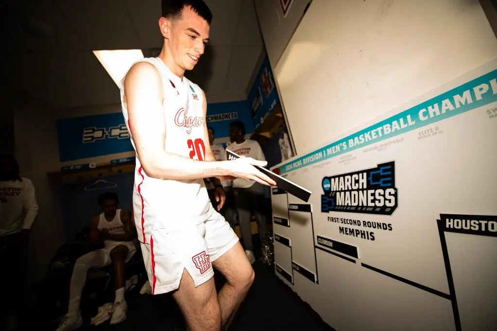 Senior walk-on turned NCAA Tournament hero Ryan Evlin got the honor of advancing Houston on the locker room NCAA Tournament bracket. (Photo by Matthew A. Smith, courtesy UH athletics).