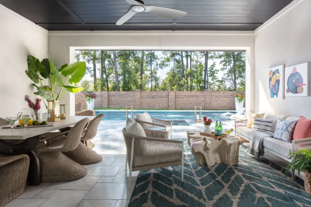 The outdoor living space, with pool and dining area, is a favorite for entertaining when the weather allows.